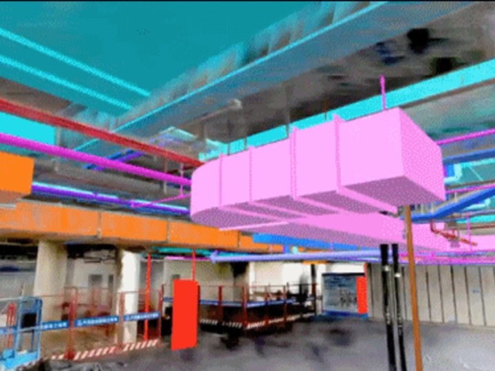 Color-coded BIM pipes and ducts aligned to a scanned building interior for on-site BIM coordination and clash checks.