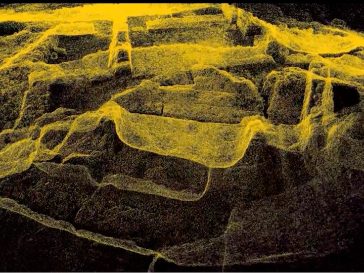 Yellow LiDAR point cloud of an archaeological ruin with terraced stone structures, a digital record for heritage preservation.