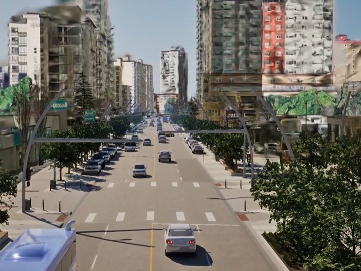 Photoreal 3D reconstruction of an urban street with buildings, traffic and trees, capturing public infrastructure at scale.