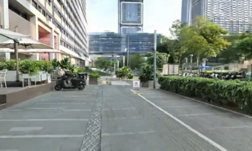 Photoreal 3DGS reconstruction of a large urban plaza with buildings and walkways, rendered at scale with LOD streaming.